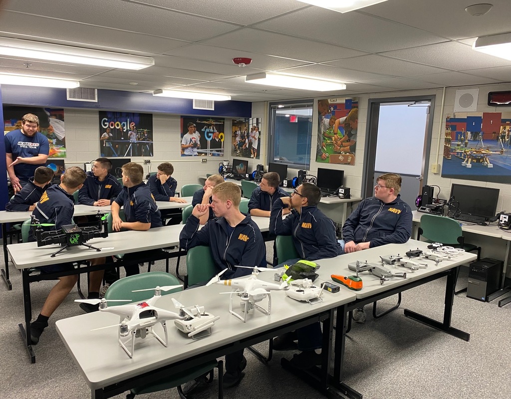 students in classroom with drones