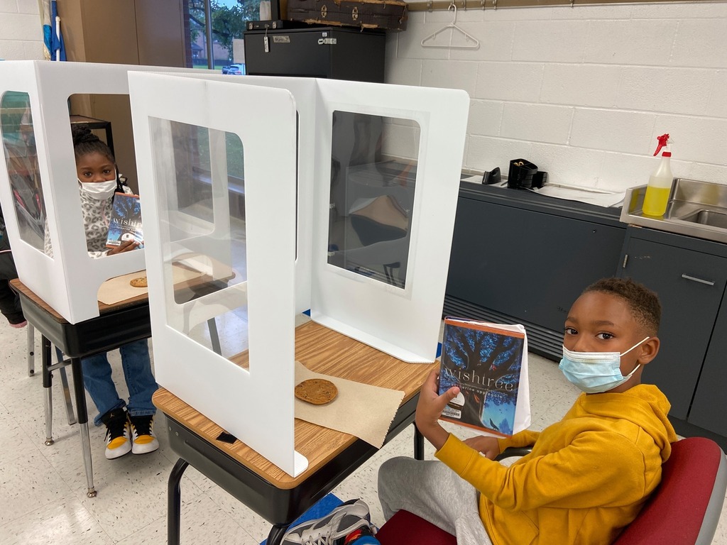 Student showing off their reading book