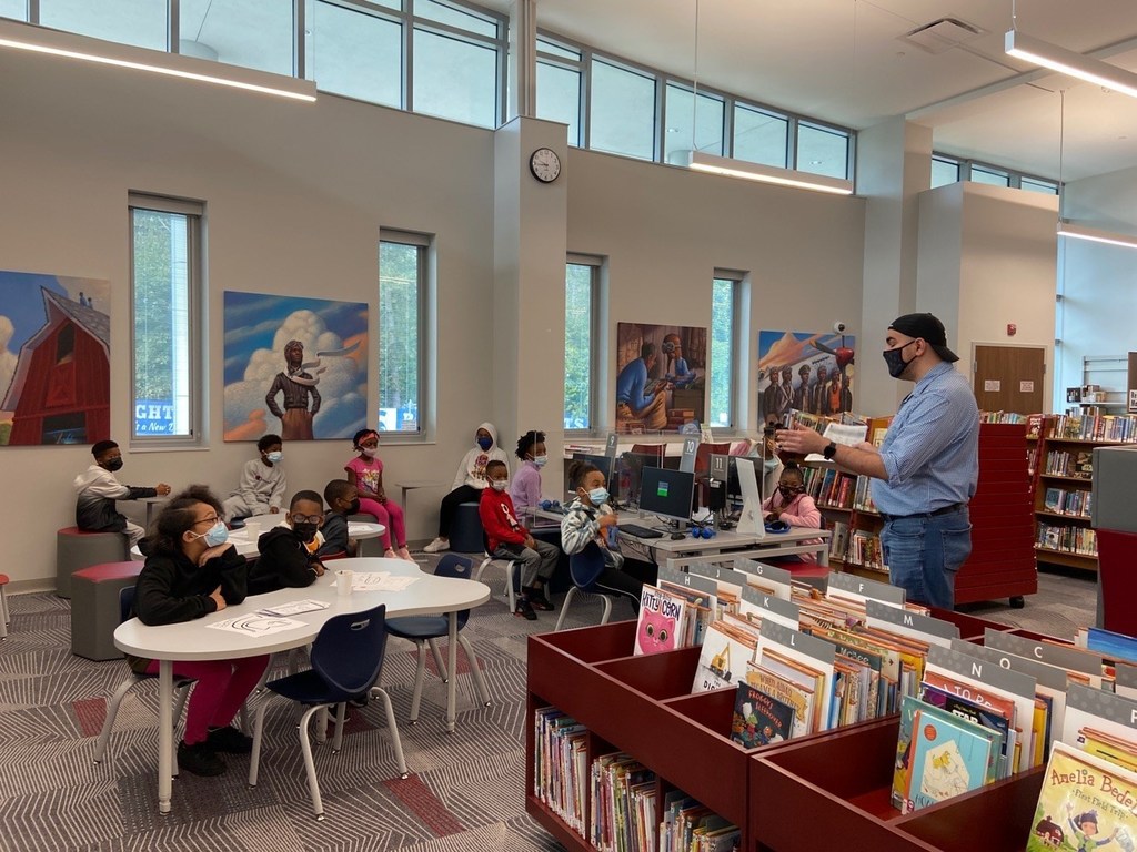 Class reading a book together