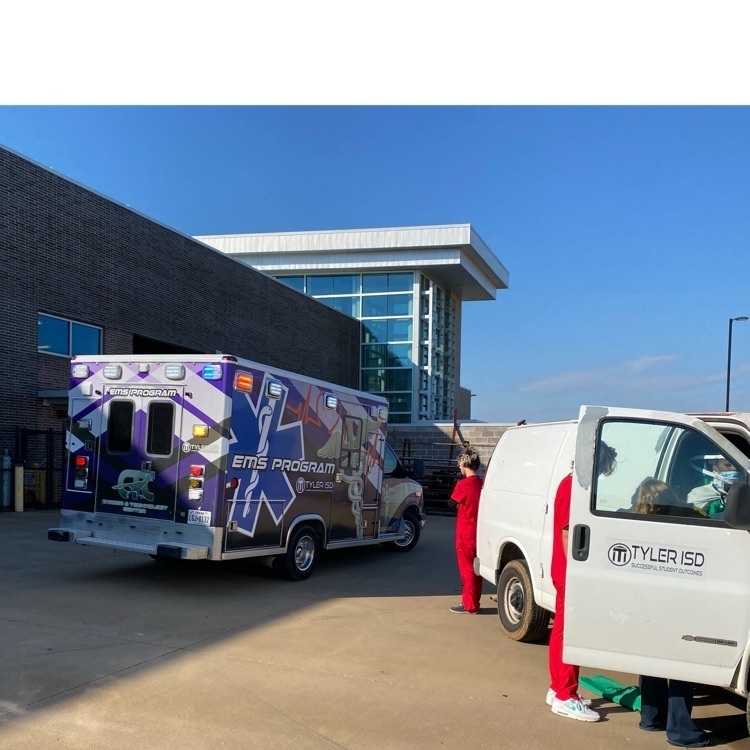 EMT students practicing with ambulance