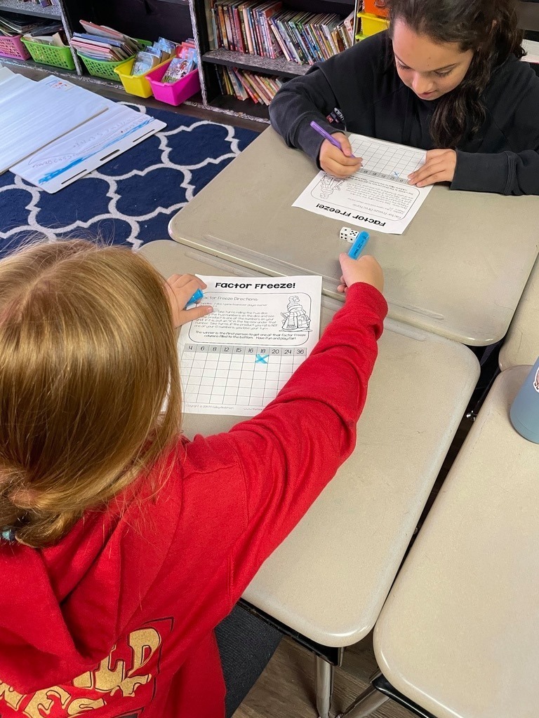 girls working on factor flip sheets