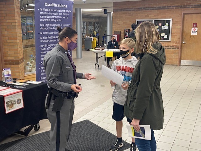 A student exploring a career with his mother.