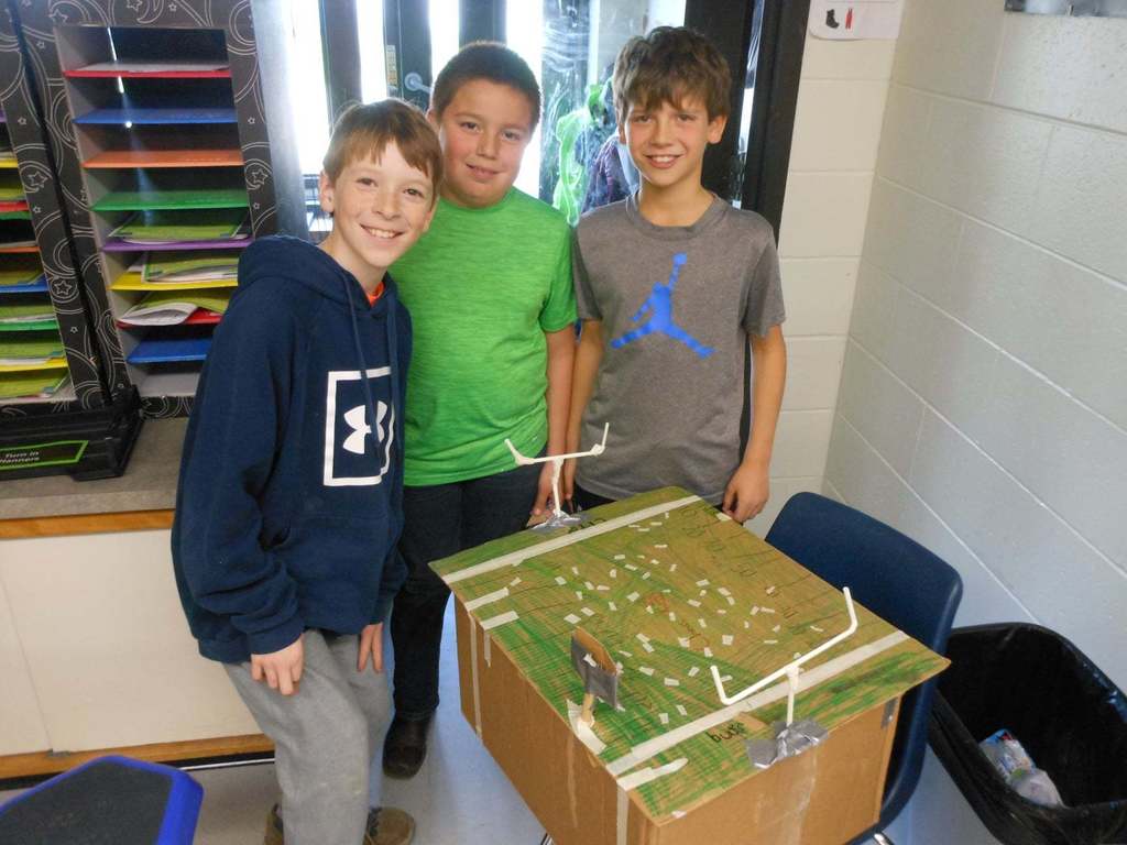 Students building cardboard games