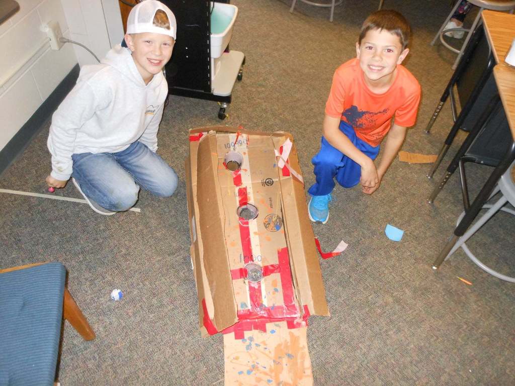 Students building cardboard games