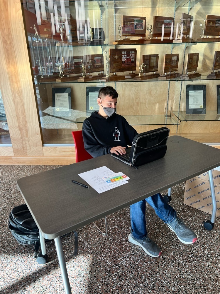 student checking people in to give blood