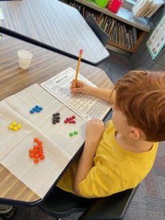 student with colored M&Ms