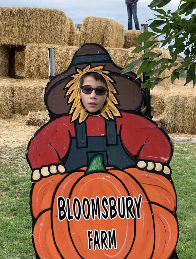 Student with photo board