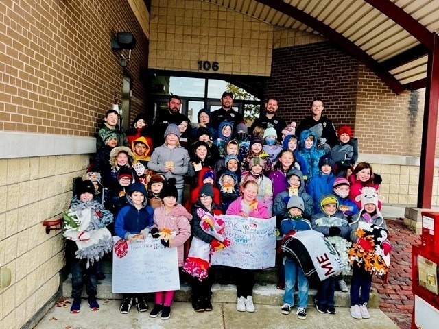 Students thanking police officers