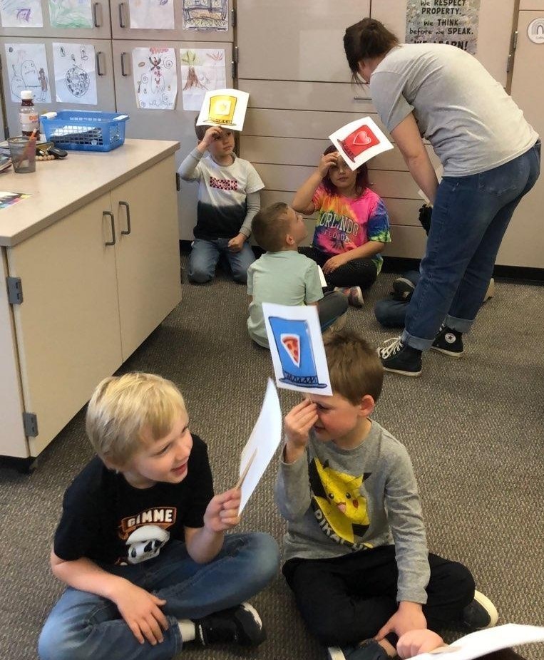 Teacher working with students using the 6 Hats strategy