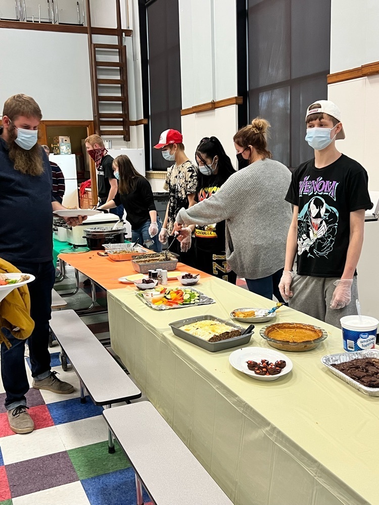 students serving a meal 