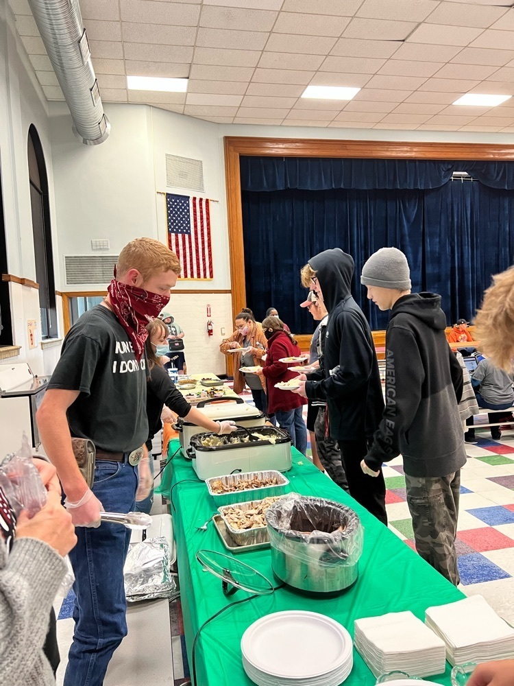 students serving a meal 