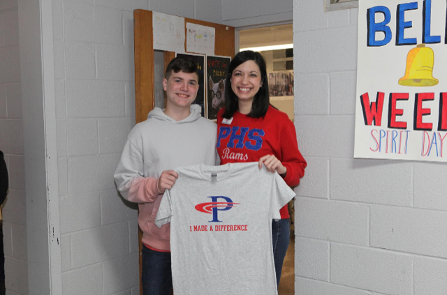 Teacher receiving I Made a Difference T-shirt