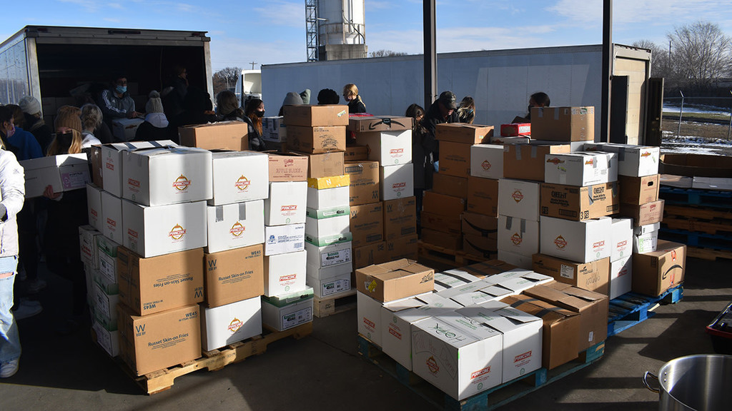 Photo of boxes of donated food collected by MAPS students