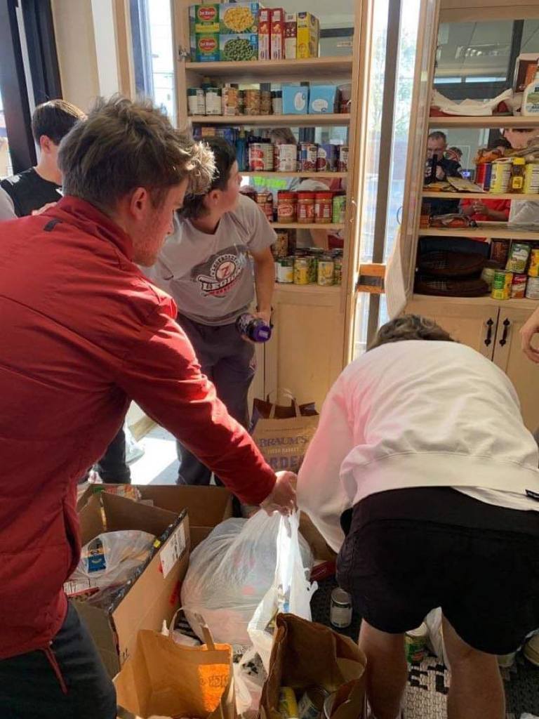 Baseball team loading shelves
