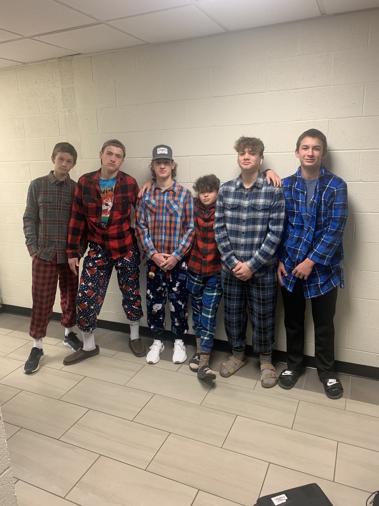 8th grade boys dressed in holiday flannels