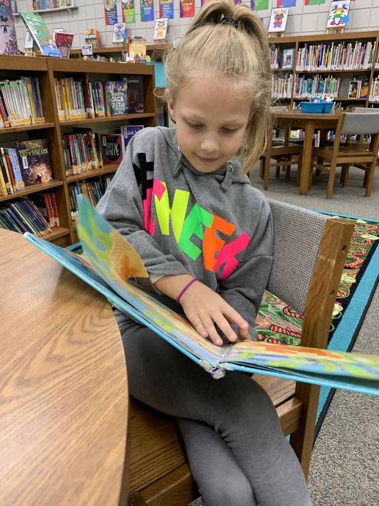 2nd Graders Drop Everything And Read During their library visit. Because, sometimes, you just need to read! #CPSZEBRAPRIDE