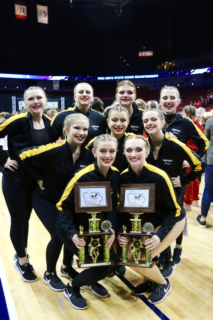 Team photo with award plaques