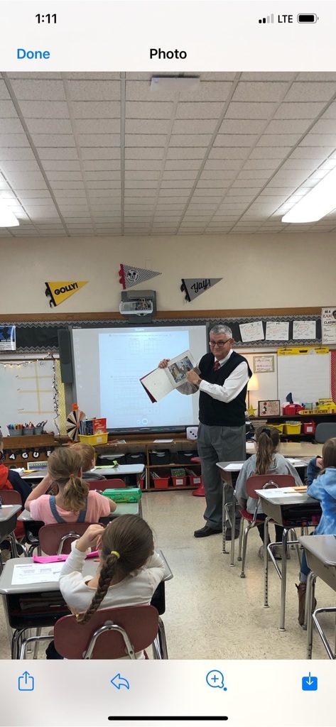 Mr. Gast reading to students.