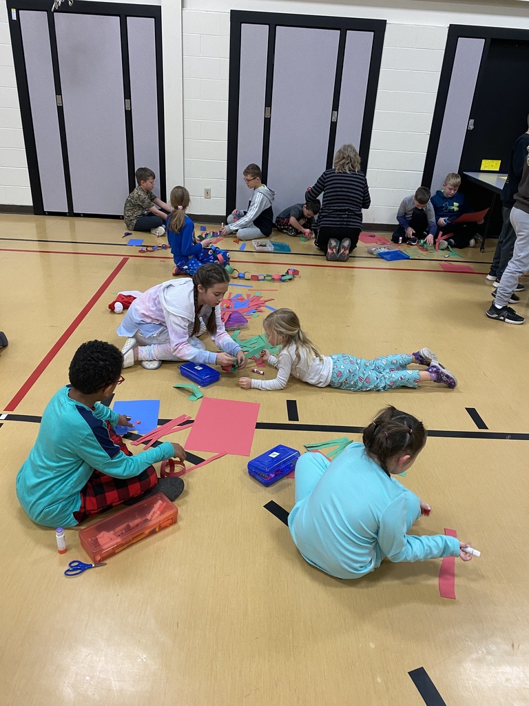 Students working together to make paper chains