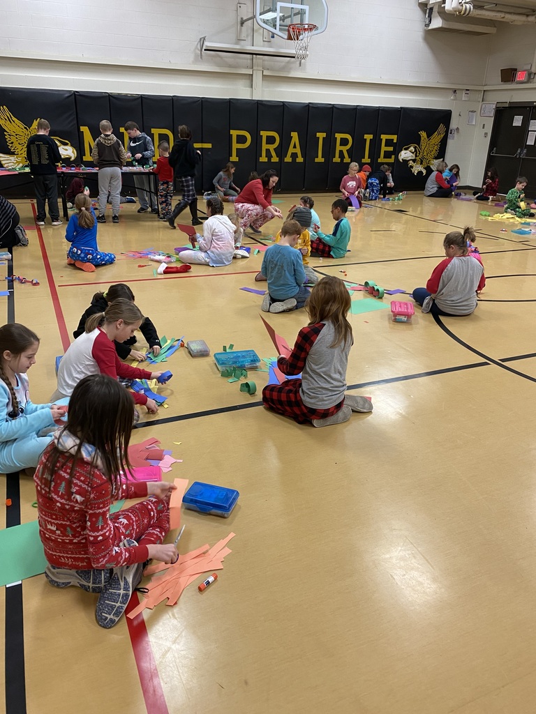 Students working together to make paper chains