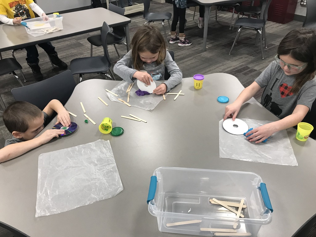 Three students building