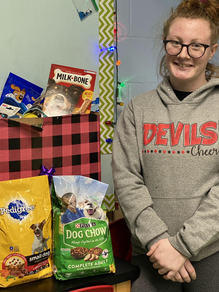 Ava Hanrahan with donated pet supplies