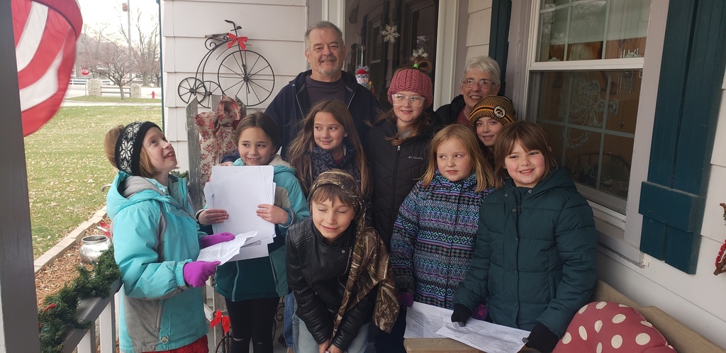 Students caroling with residents