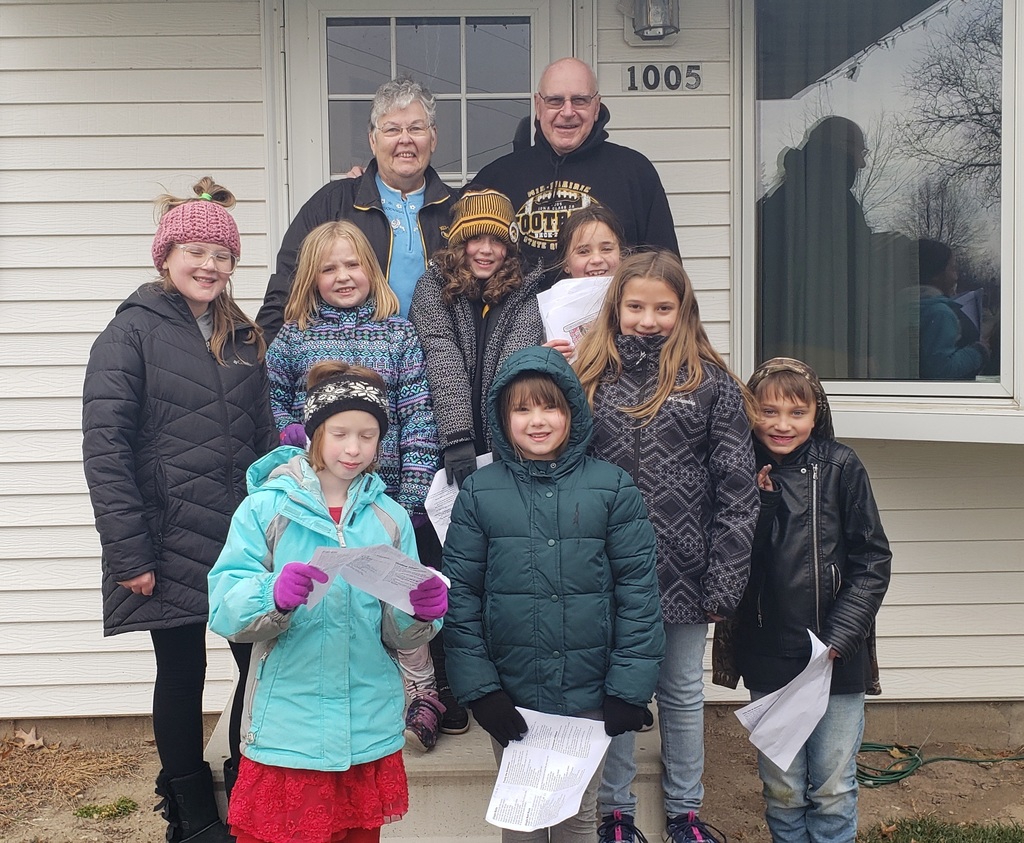 Students caroling with residents