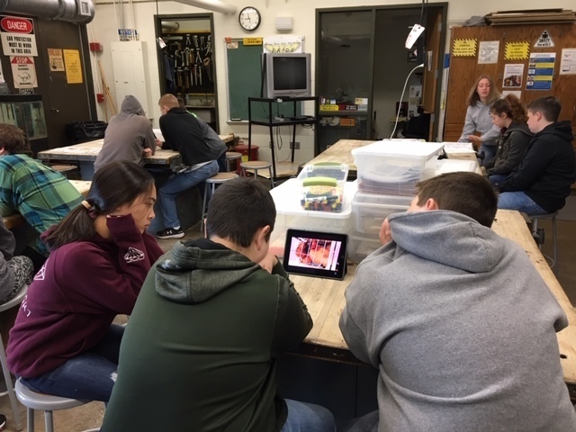 Students watch a video during agriculture class at the middle school
