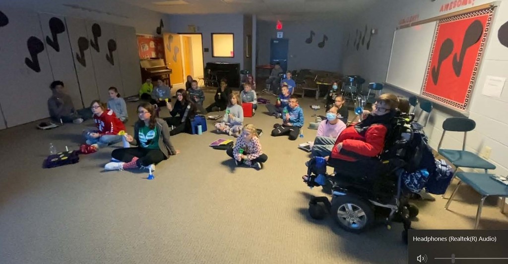 Students ringing holiday bells in music class