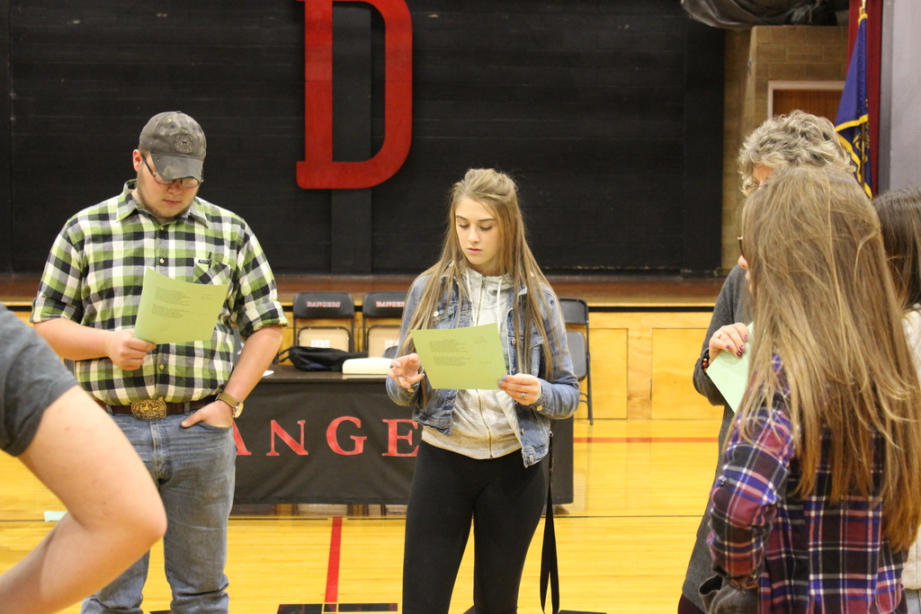 Students read their parts.