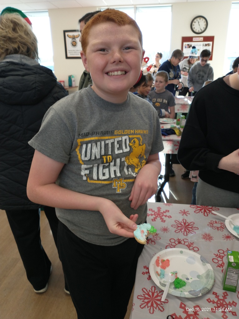 Student decorating a cookie