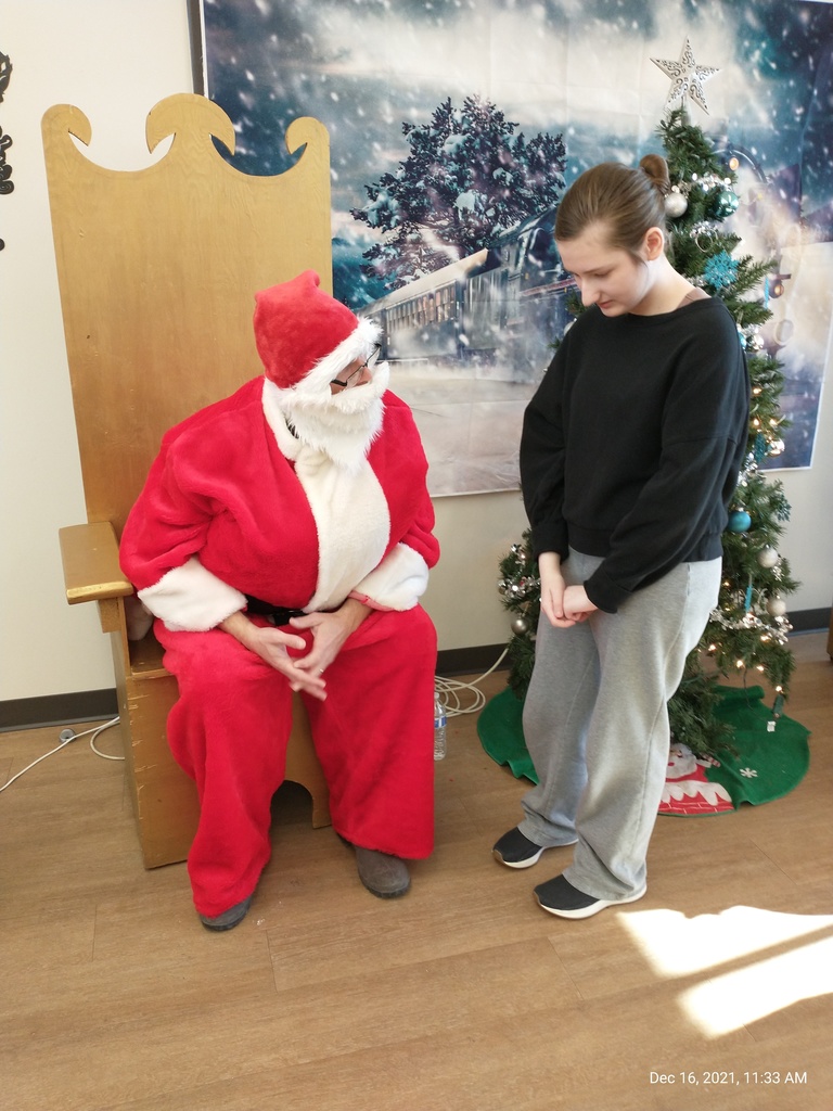 Student visiting with Santa