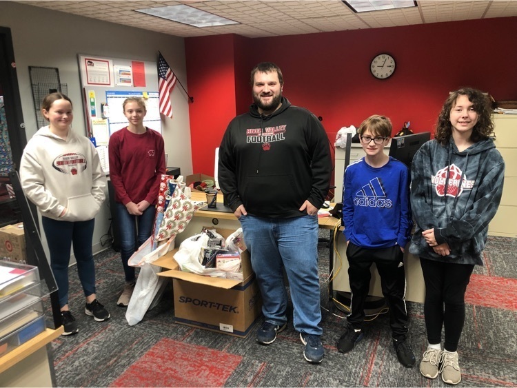7th graders delivering presents to the elementary