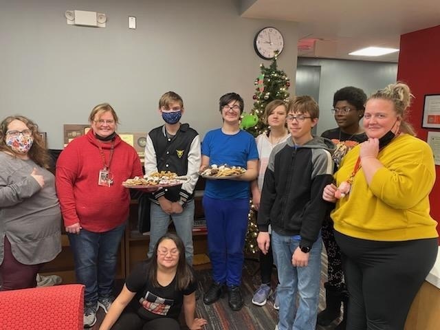 students posing with cookies