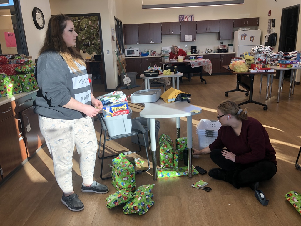 Students wrapping gifts