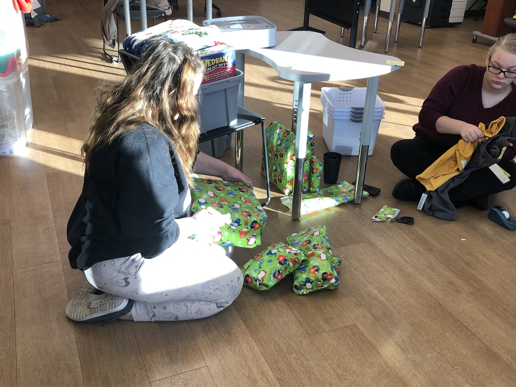 Students wrapping gifts