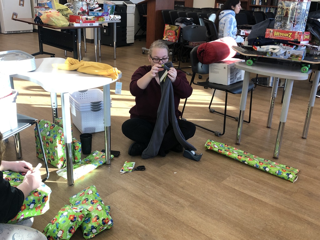 Students wrapping gifts