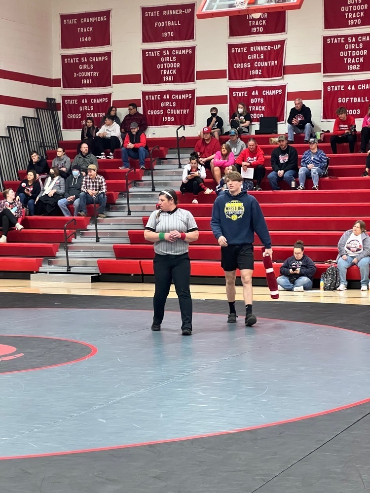 two people on a wrestling mat