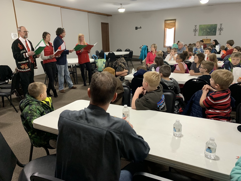 Carolers singing to audience