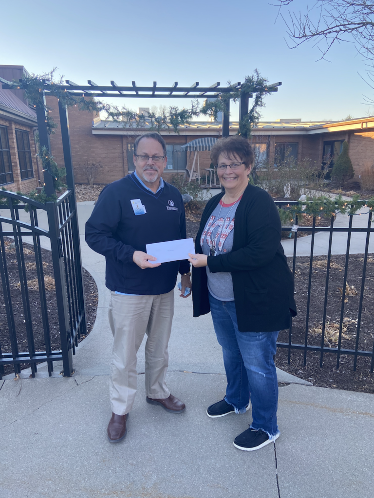 Joyce Billups presenting donation check