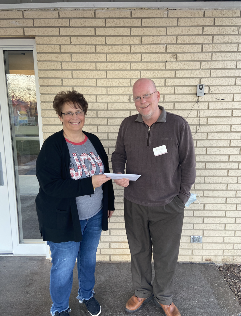 Joyce Billups presenting donation check