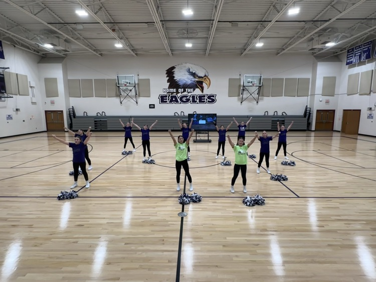 Cheerleading to the school song.