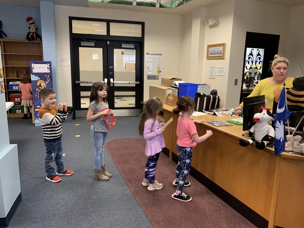 kids checking out library books