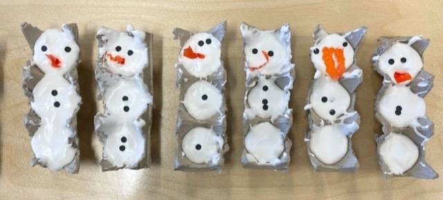 The kids put puffy paint (shaving cream and glue) in small egg cartons to make snowmen