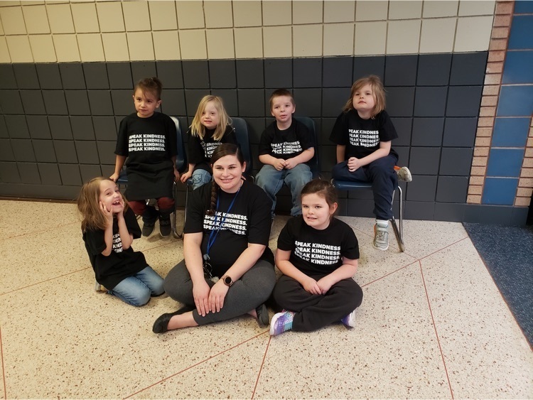 students and teacher in kindness shirts