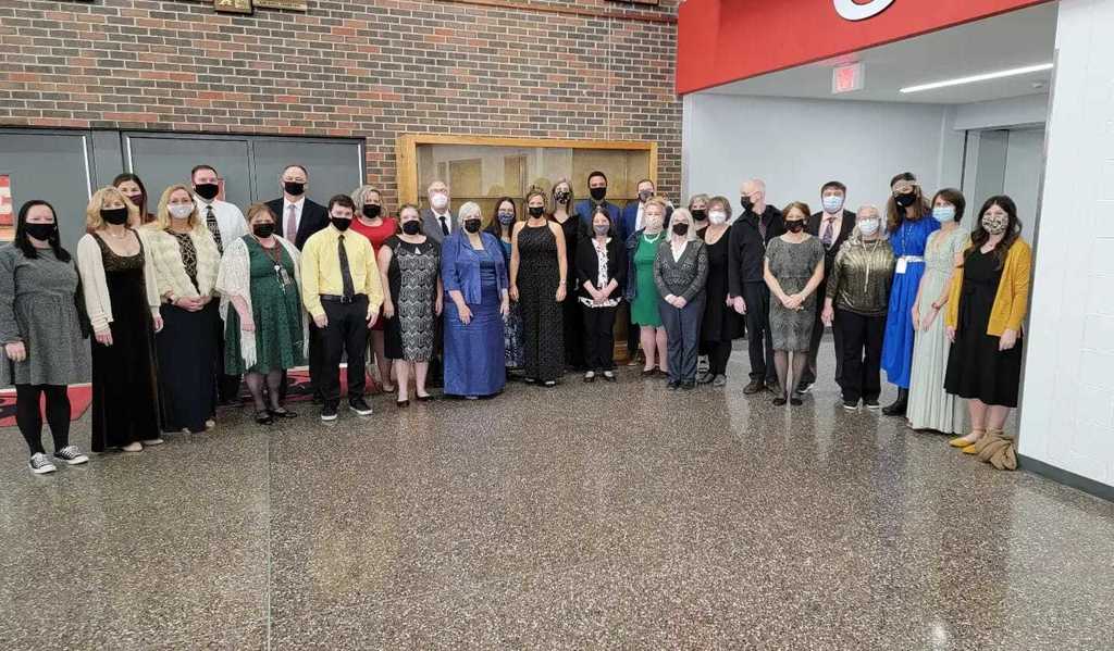 teachers posing in fancy clothes