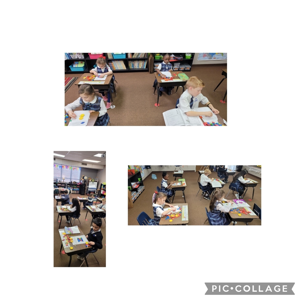 First grade creating shapes with patterns blocks during geometry.