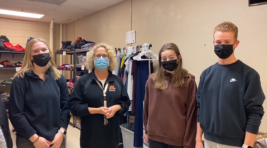 NHS students in the Spud Closet showing items available