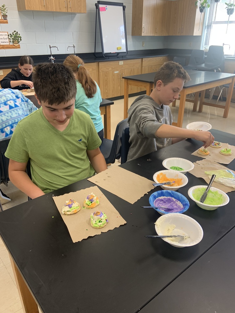 Students frosting cookies.